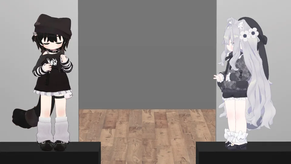 運営者がVRChatで別途撮影した参考写真。二人のアバターが手を前に構えている。