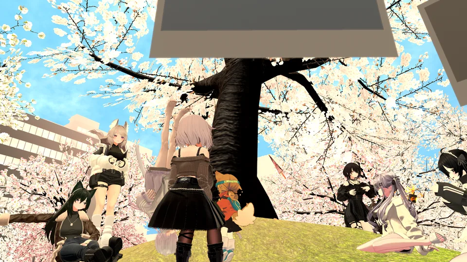 運営者がVRChatで別途撮影した参考写真。桜のあるワールド内に集まるアバター。